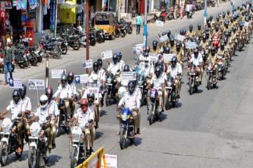 Tirupati urban police take out helmet awareness rally