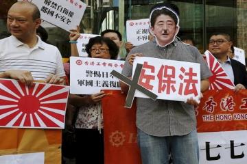 China slams Japan over security bills