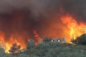 Northern California wildfire doubles in size, displaces thousands
