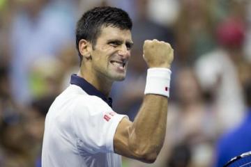 Djokovic fights his way into US Open quarters