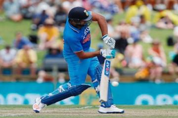 Rohit, Dhoni look to take India over 300