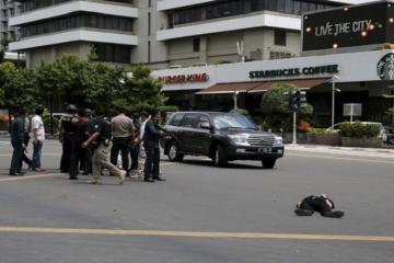 Six dead in serial explosions in Jakarta; suicide bombers, gunmen spotted